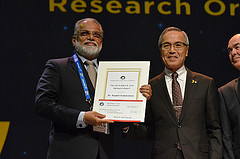 Dr. Koppillil Radhakrishnan recieves the 2014 Allan D. Emil Memorial Award from IAF President Kiyoshi Higuchi at the IAC Opening Ceremony in Toronto, Canada.